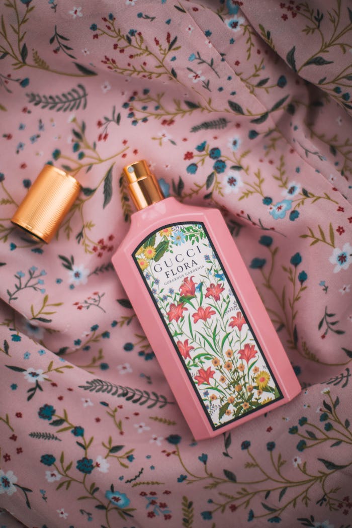 brand-02 Elegant Gucci Flora perfume bottle on floral patterned fabric for beauty and lifestyle.
